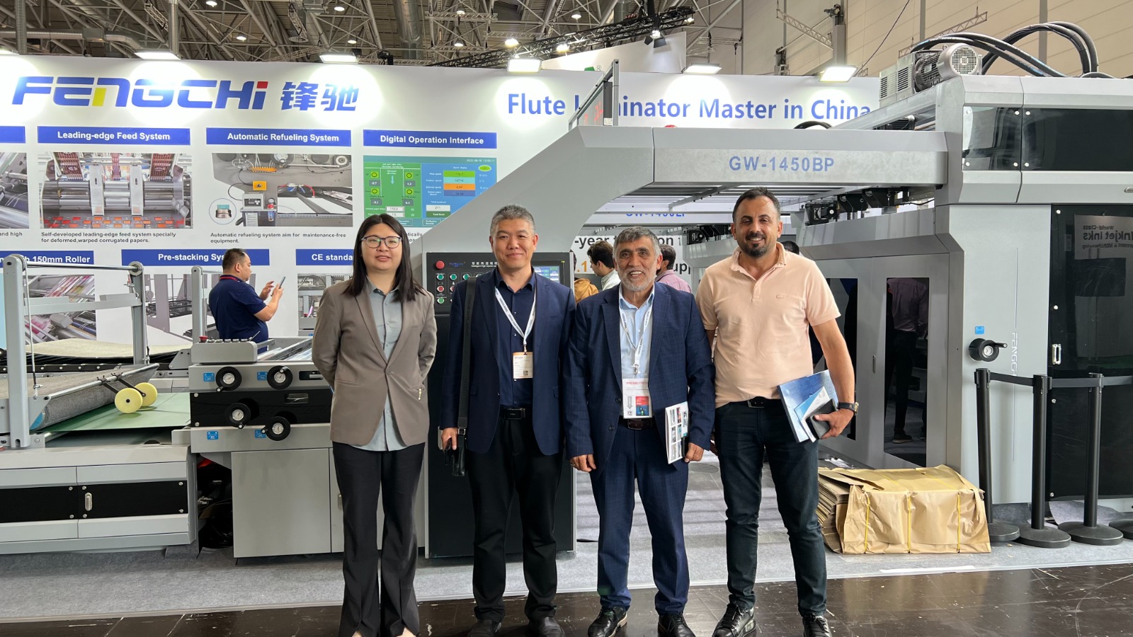 KMK team and machinery at trade show